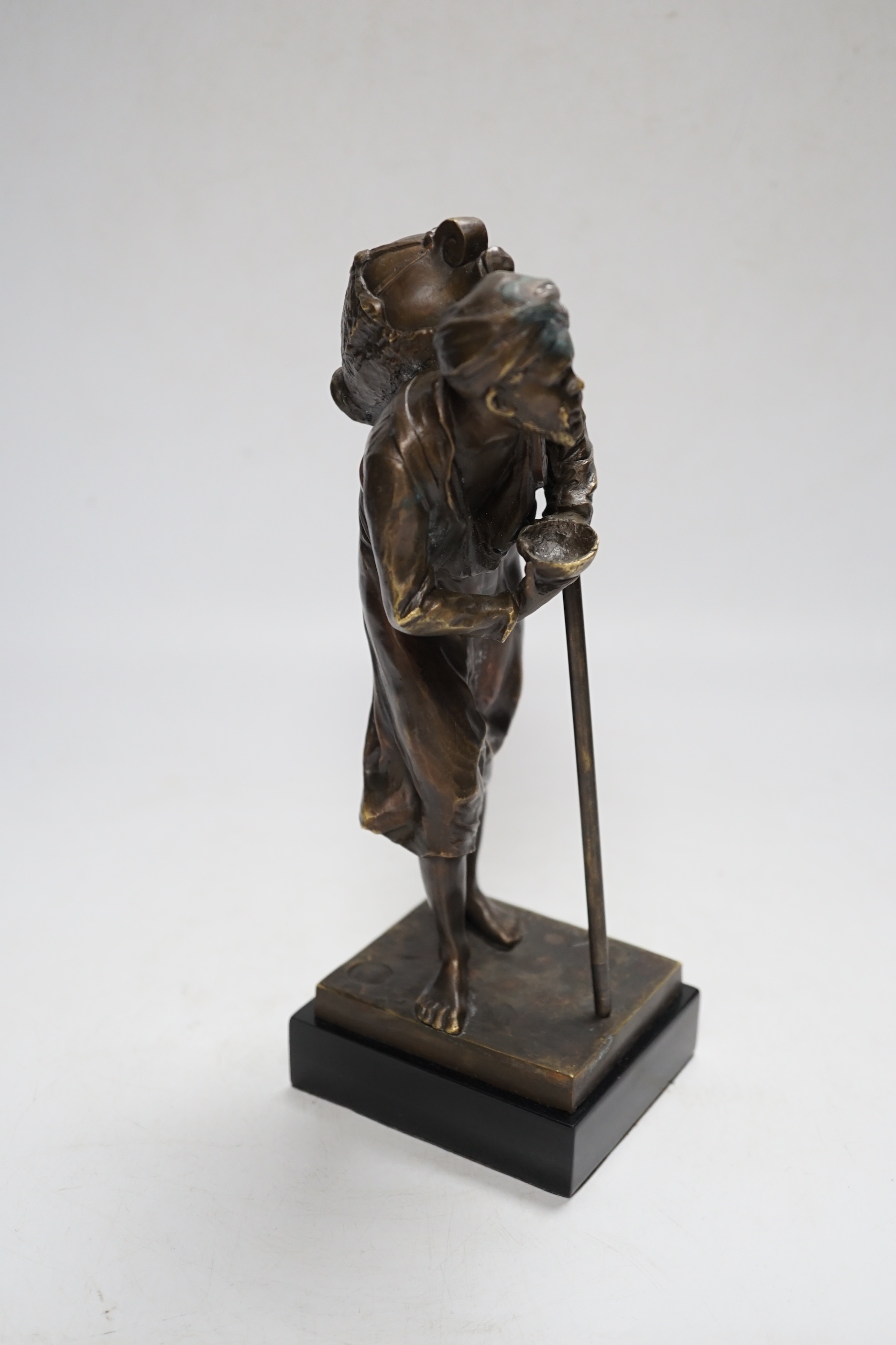 After Paul Ludwig Kowalczewski, a bronze of an African wine seller, 24cm